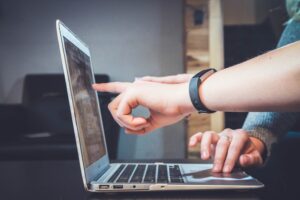 Person troubleshooting CAC card issues on computer